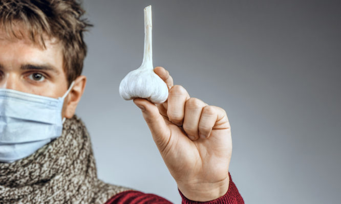 Photo of man wears protective mask against infectious diseases and flu.